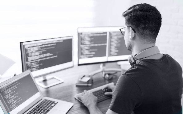 Developer working with multiple screens